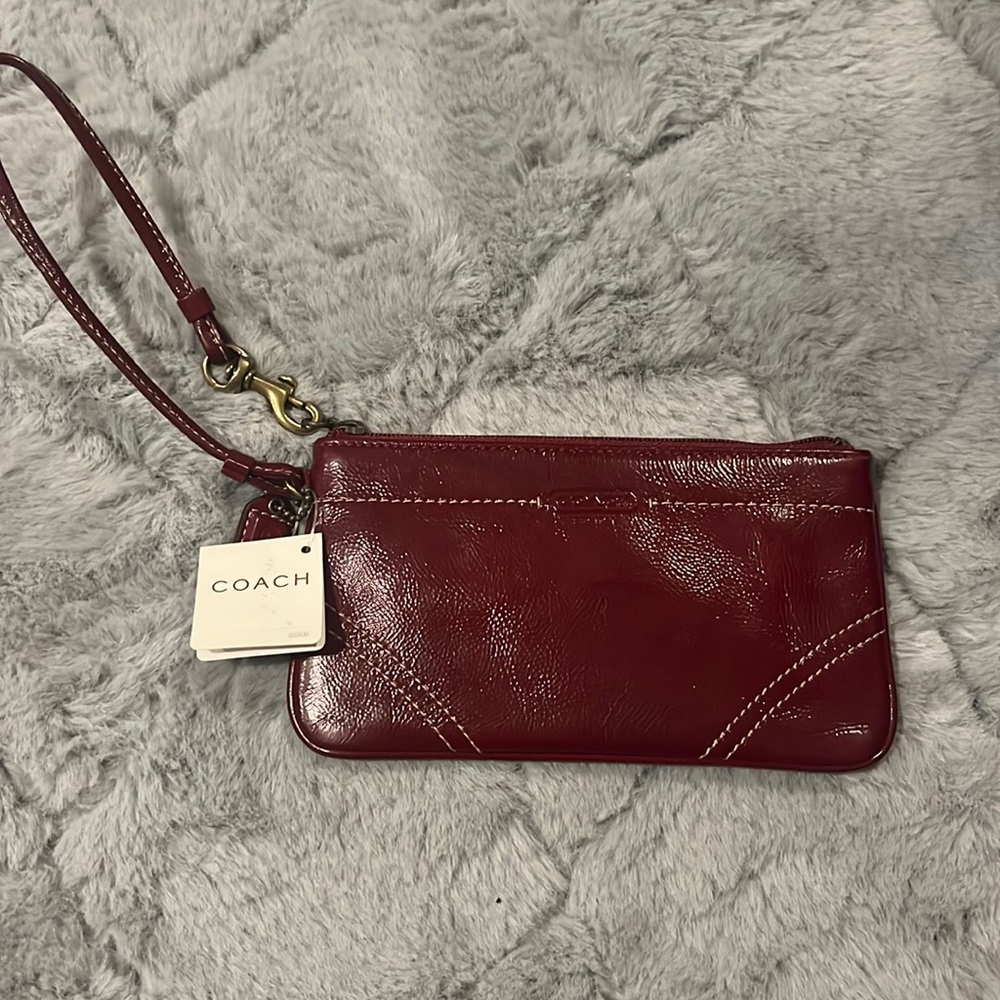 red /maroon leather coach wristlet